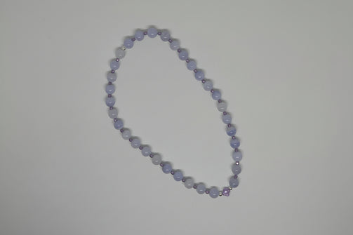 Blue lace agate bracelet/ tasbeeh/ misbaha beads on a light grey backgound. Amethyst clover caharm, purple czech crystals